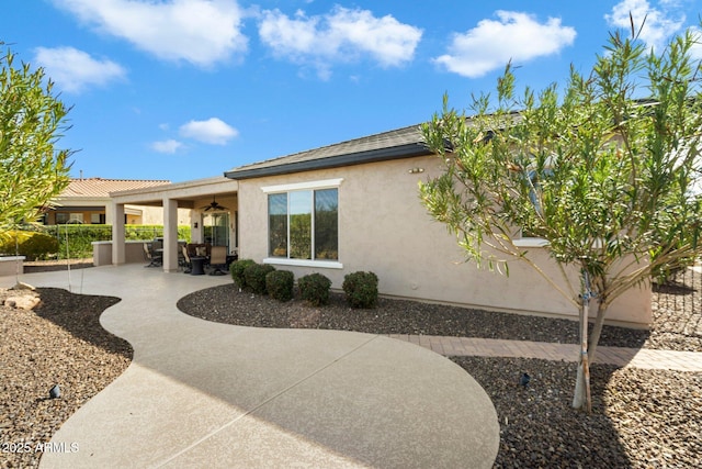 rear view of property with a patio area