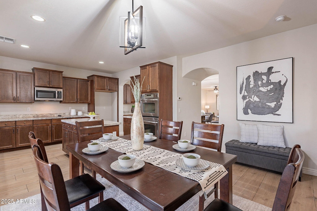 dining area with light hardwood / wood-style flooring