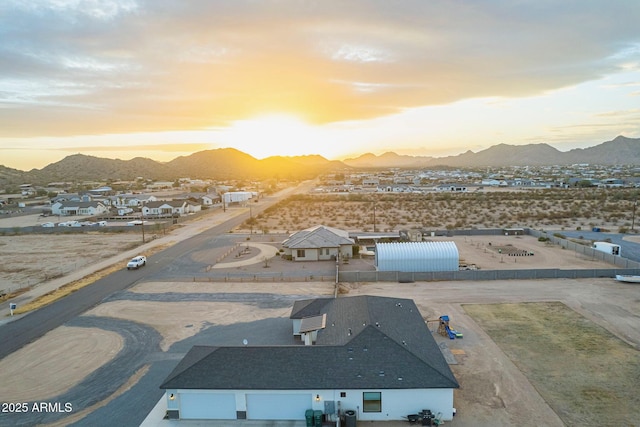 aerial view at dusk with a residential view and a mountain view