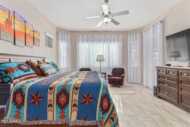 bedroom with light tile floors and ceiling fan