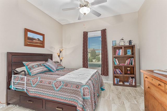 bedroom with ceiling fan and light tile flooring