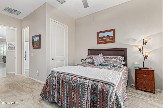 bedroom featuring ceiling fan and light tile flooring