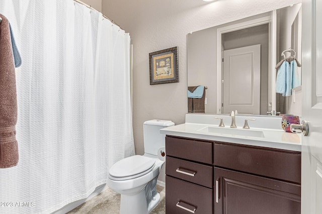 bathroom featuring tile floors, toilet, and oversized vanity