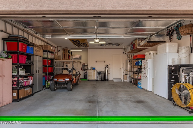 garage with white refrigerator