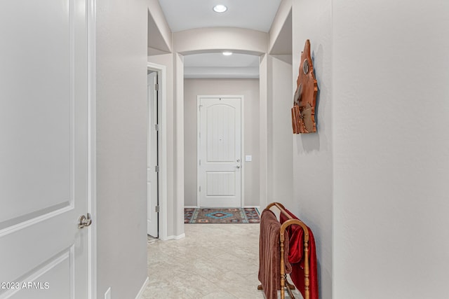 corridor featuring light tile floors