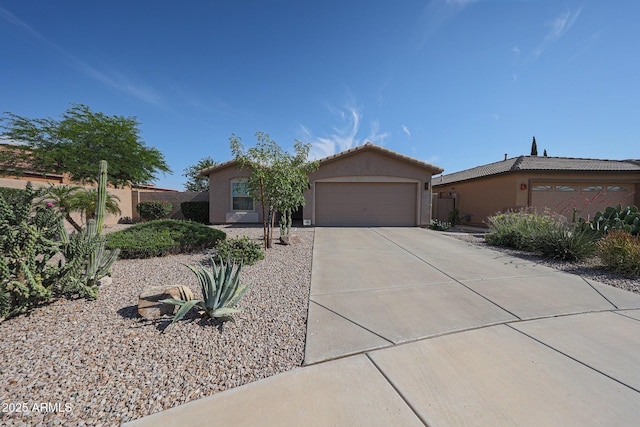10371 W Pontiac Dr, Peoria, AZ 85382 - view of front facade with stucco siding, a garage, concrete driveway, and a tiled roof