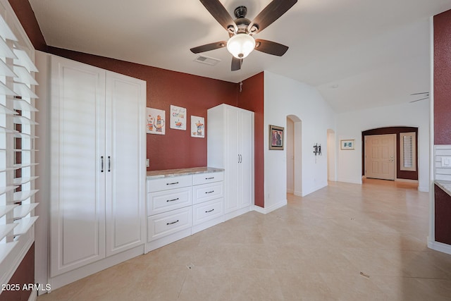 10371 W Pontiac Dr, Peoria, AZ 85382 - unfurnished bedroom featuring arched walkways, lofted ceiling, a ceiling fan, and baseboards