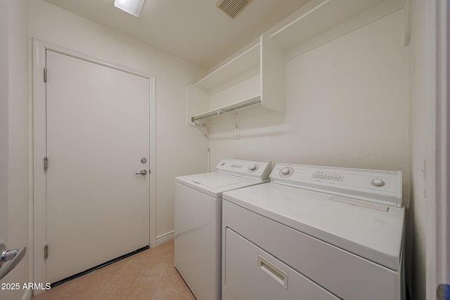 10371 W Pontiac Dr, Peoria, AZ 85382 - laundry area featuring separate washer and dryer and light tile patterned flooring