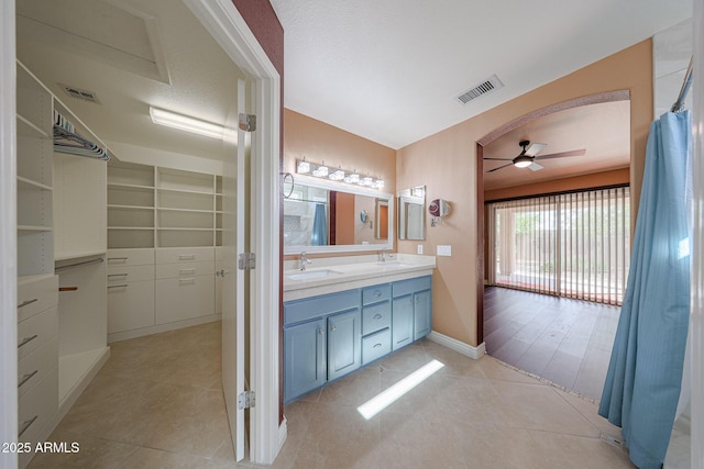 10371 W Pontiac Dr, Peoria, AZ 85382 - full bathroom featuring ceiling fan, tile patterned flooring, double vanity, and baseboards