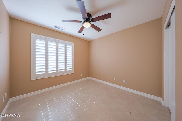 10371 W Pontiac Dr, Peoria, AZ 85382 - empty room with light tile patterned floors, a ceiling fan, and baseboards