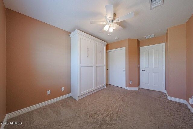 10371 W Pontiac Dr, Peoria, AZ 85382 - unfurnished bedroom featuring light colored carpet, baseboards, a closet, and a ceiling fan