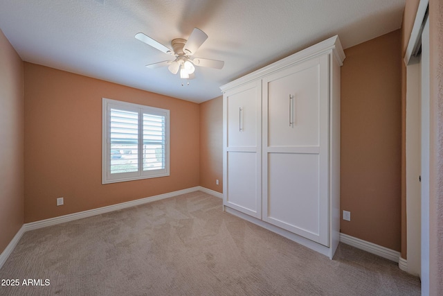 10371 W Pontiac Dr, Peoria, AZ 85382 - unfurnished bedroom with light carpet, baseboards, and ceiling fan