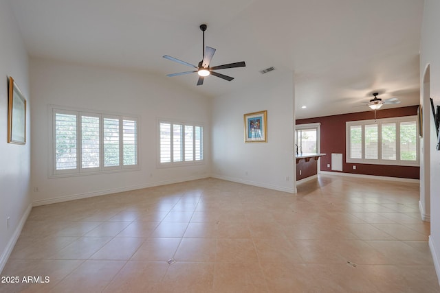 10371 W Pontiac Dr, Peoria, AZ 85382 - empty room featuring ceiling fan, baseboards, light tile patterned floors, and lofted ceiling