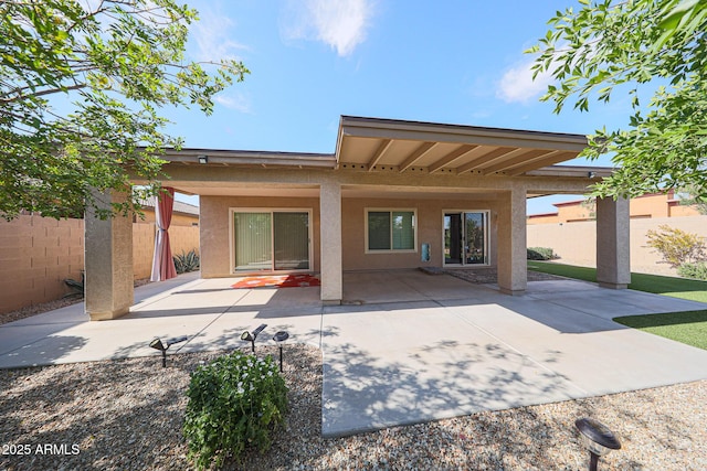 10371 W Pontiac Dr, Peoria, AZ 85382 - rear view of house with stucco siding and a patio