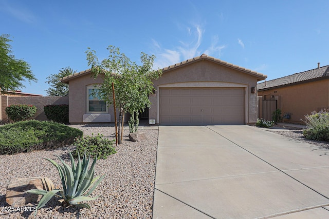 10371 W Pontiac Dr, Peoria, AZ 85382 - view of front of house with driveway, stucco siding, an attached garage, and a tile roof