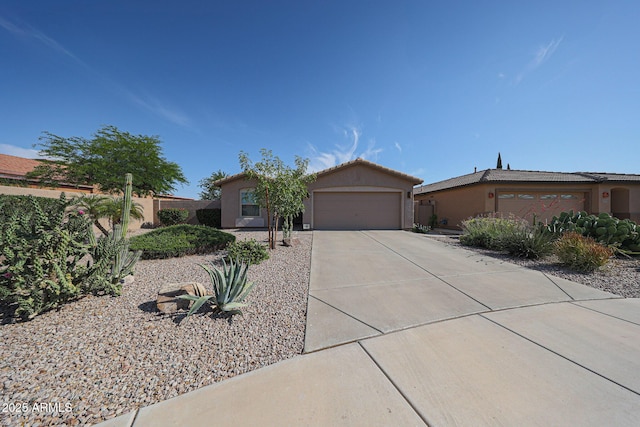 10371 W Pontiac Dr, Peoria, AZ 85382 - view of front facade featuring an attached garage, driveway, and stucco siding