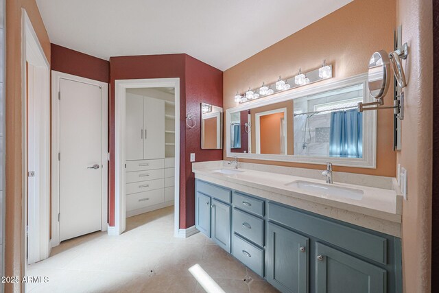 10371 W Pontiac Dr, Peoria, AZ 85382 - bathroom with double vanity, a closet, a shower, tile patterned floors, and baseboards