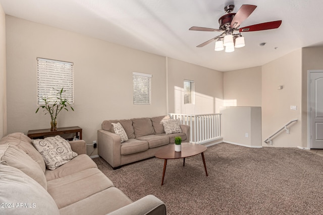 carpeted living room featuring ceiling fan