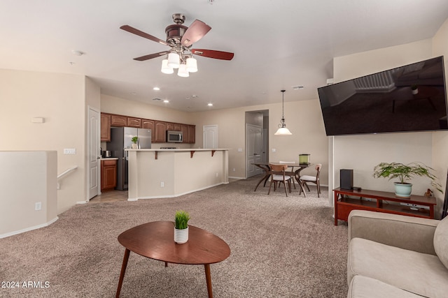 living room featuring light carpet and ceiling fan