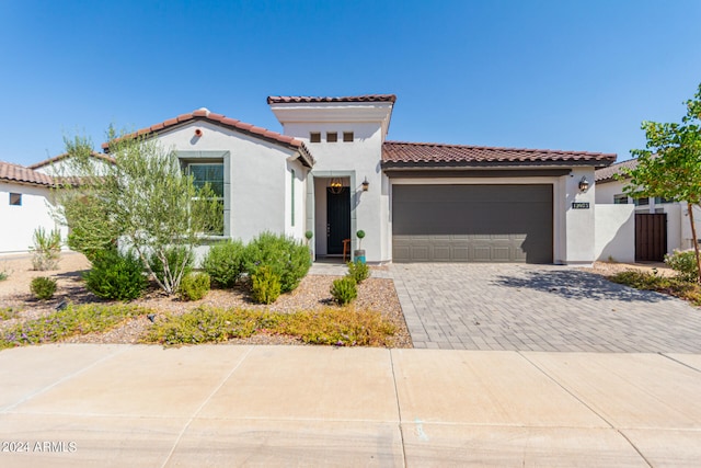 mediterranean / spanish-style house featuring a garage