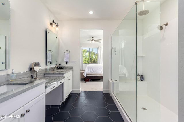 bathroom with a shower, tile patterned flooring, vanity, and ceiling fan