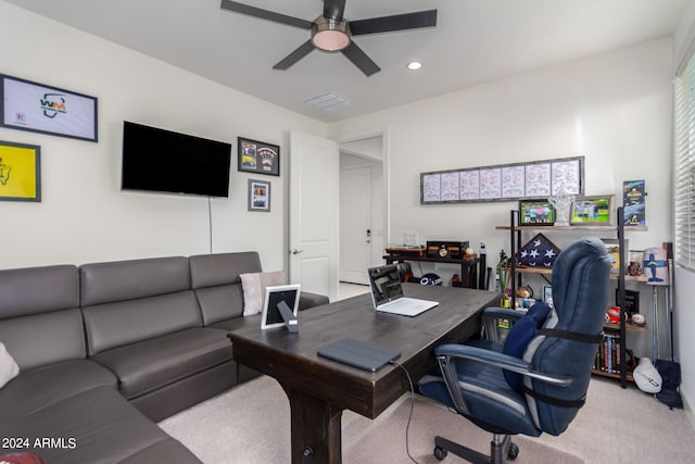 office space with light carpet and ceiling fan