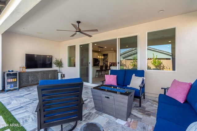 view of patio with beverage cooler, ceiling fan, and an outdoor hangout area