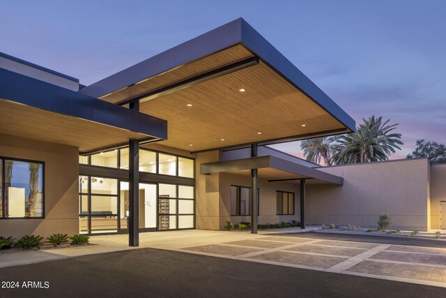 view of outdoor building at dusk