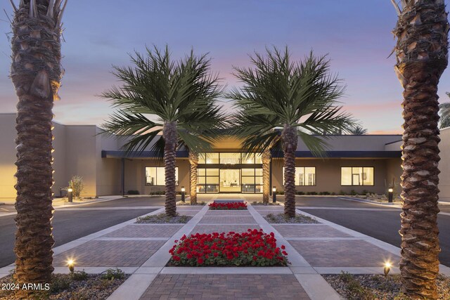 view of outdoor building at dusk