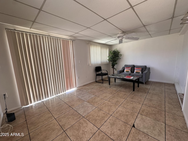 2115 W Myrtle Ave, Phoenix, AZ 85021 - living area with a drop ceiling, light tile patterned flooring, a ceiling fan, and baseboards