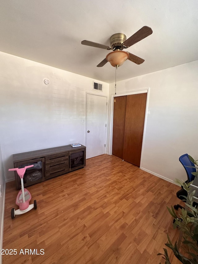 2115 W Myrtle Ave, Phoenix, AZ 85021 - bedroom featuring wood finished floors, ceiling fan, and a closet