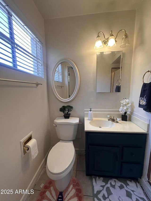 2115 W Myrtle Ave, Phoenix, AZ 85021 - half bathroom with tile patterned floors, toilet, vanity, and baseboards