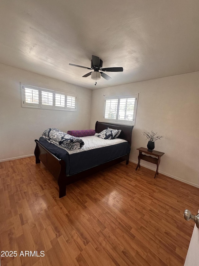 2115 W Myrtle Ave, Phoenix, AZ 85021 - bedroom featuring multiple windows, wood finished floors, and a ceiling fan