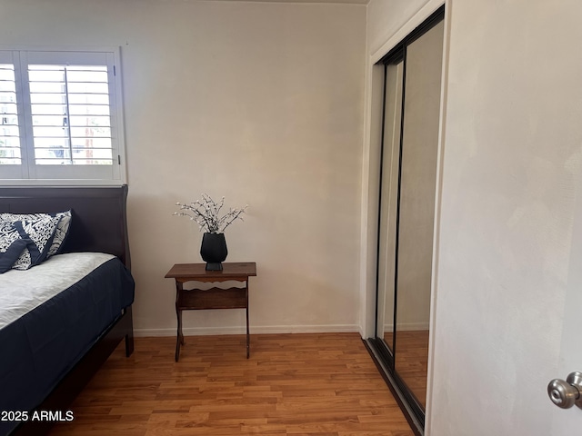 2115 W Myrtle Ave, Phoenix, AZ 85021 - bedroom featuring wood finished floors, a closet, and baseboards