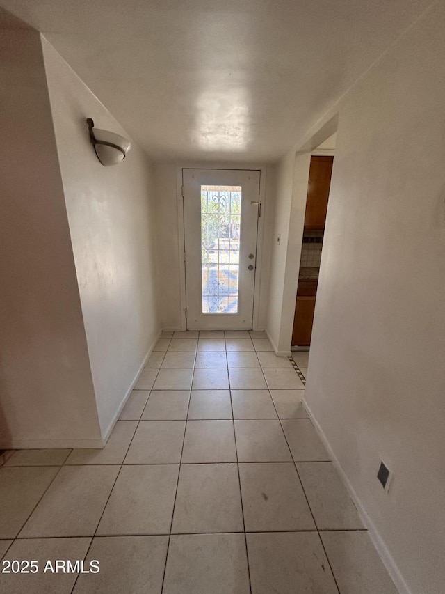 2115 W Myrtle Ave, Phoenix, AZ 85021 - doorway featuring baseboards and light tile patterned floors