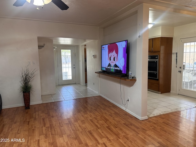 2115 W Myrtle Ave, Phoenix, AZ 85021 - foyer entrance featuring light wood-type flooring, a ceiling fan, plenty of natural light, and baseboards