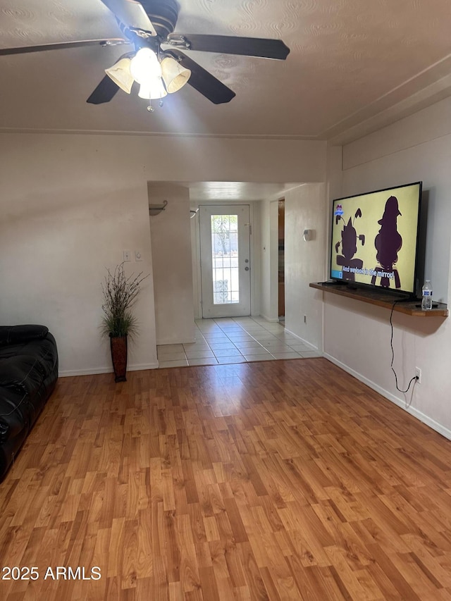 2115 W Myrtle Ave, Phoenix, AZ 85021 - unfurnished living room with wood finished floors, baseboards, and ceiling fan