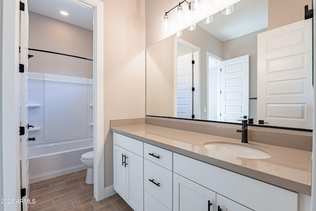 full bathroom featuring vanity, toilet, and bathing tub / shower combination