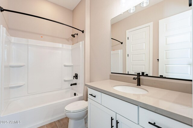 full bathroom with vanity, bathtub / shower combination, and toilet