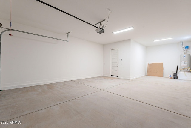 garage with a garage door opener and water heater