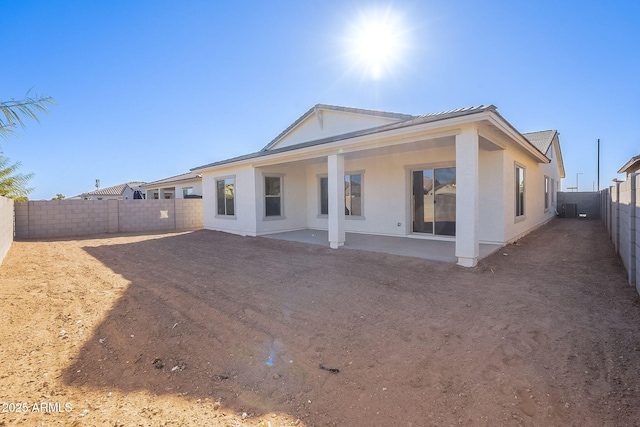 rear view of property with a patio