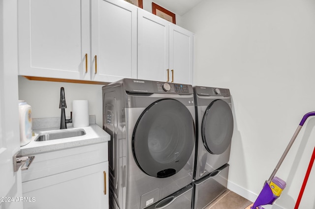 5151 N 13th Pl Unit 4, Phoenix, AZ 85014 - washroom featuring washer and dryer, cabinet space, and tile patterned flooring