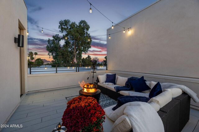 5151 N 13th Pl Unit 4, Phoenix, AZ 85014 - patio terrace at dusk featuring an outdoor living space with a fire pit