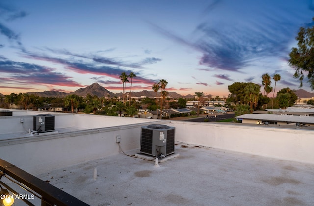 5151 N 13th Pl Unit 4, Phoenix, AZ 85014 - patio terrace at dusk with central AC and a mountain view