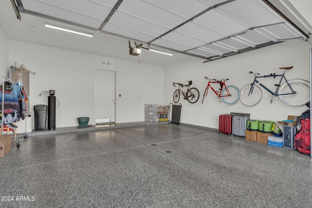 5151 N 13th Pl Unit 4, Phoenix, AZ 85014 - garage featuring a garage door opener and water heater
