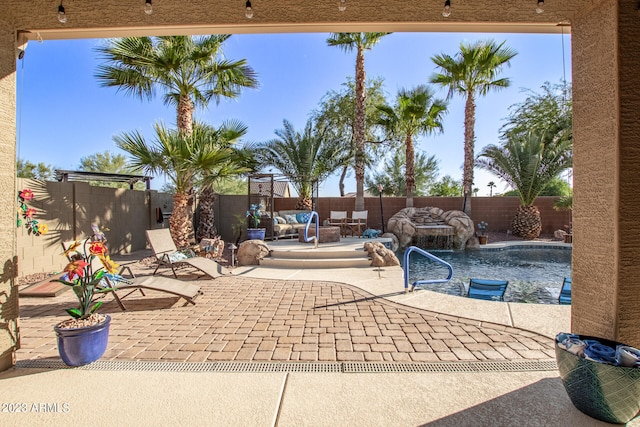 view of patio / terrace featuring a fenced in pool and pool water feature