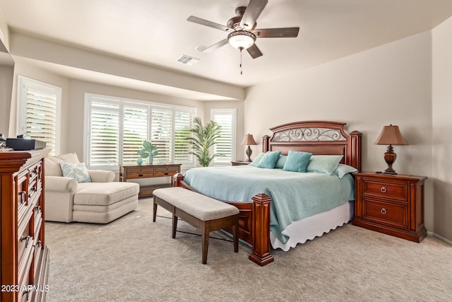 carpeted bedroom featuring ceiling fan