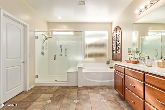 bathroom with separate shower and tub and vanity