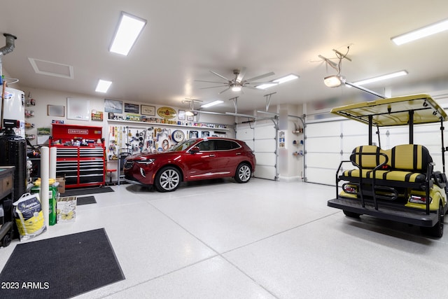 garage with a garage door opener and ceiling fan