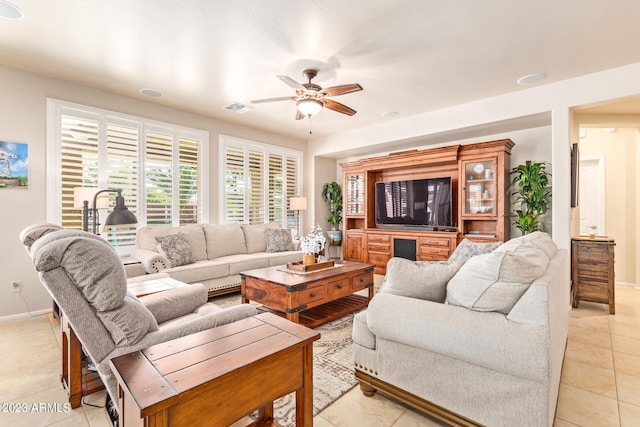 tiled living room featuring ceiling fan